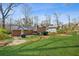 Back exterior view showcasing the patio, backyard, and well-maintained landscaping at 731 Fern Se St, Marietta, GA 30067