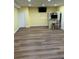 Finished basement featuring wood-look flooring, bar area, and seating at 4038 Se Clay Court Se Se, Conyers, GA 30013