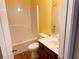 Standard bathroom with a combined tub and shower and a cherry wood vanity at 4038 Se Clay Court Se Se, Conyers, GA 30013