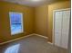 Bedroom features neutral carpet, closet, and window with view at 4038 Se Clay Court Se Se, Conyers, GA 30013