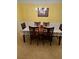 Formal dining room featuring a chandelier, decorative wainscoting, and a table set for six at 4038 Se Clay Court Se Se, Conyers, GA 30013