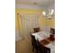 A view of dining room with chandelier and white curtains at 4038 Se Clay Court Se Se, Conyers, GA 30013