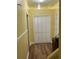 Hallway features wood floor, closet, and traditional design elements at 4038 Se Clay Court Se Se, Conyers, GA 30013