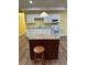 Kitchen island with stool and white appliances at 4038 Se Clay Court Se Se, Conyers, GA 30013