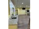 Spacious kitchenette features new wood flooring, television, and ample lighting at 4038 Se Clay Court Se Se, Conyers, GA 30013