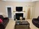 Inviting living room with a fireplace, comfortable seating, and a bright window at 4038 Se Clay Court Se Se, Conyers, GA 30013