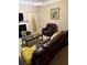 Cozy living room features a fireplace, recliner, and a decorative painting at 4038 Se Clay Court Se Se, Conyers, GA 30013