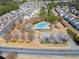 Community aerial view of amenities, a swimming pool, playground, and beautiful landscaping at 5884 Grande River Rd, Atlanta, GA 30349