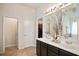 Spacious bathroom with double sinks, ample counter space, and a separate toilet room at 5884 Grande River Rd, Atlanta, GA 30349
