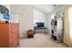 Bright bedroom with a view of a desk, a dresser, and a colorful print on the wall at 5884 Grande River Rd, Atlanta, GA 30349