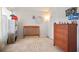 Bedroom with neutral walls, a crib, and dresser at 5884 Grande River Rd, Atlanta, GA 30349