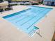 Large community swimming pool with marked lanes and a gated fence, perfect for recreation at 5884 Grande River Rd, Atlanta, GA 30349