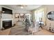 Cozy dining area with a fireplace, decorative furnishings, and stylish zebra rug at 5884 Grande River Rd, Atlanta, GA 30349