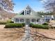 Charming home with a welcoming front porch, manicured landscaping, and a well-maintained yard at 5884 Grande River Rd, Atlanta, GA 30349