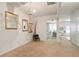Open-concept living room with neutral walls, carpet flooring and decorative mirrors at 5884 Grande River Rd, Atlanta, GA 30349