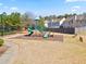 Neighborhood playground featuring slides and play structures for children, within a Gathering-friendly community at 5884 Grande River Rd, Atlanta, GA 30349