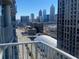 Stunning city view overlooking buildings and busy highway from a high rise balcony at 361 17Th Nw St # 1717, Atlanta, GA 30363