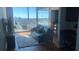 Sunlit living room with comfortable seating, city views, and a warm ambiance at 361 17Th Nw St # 1717, Atlanta, GA 30363