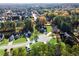 An aerial view displays a neighborhood, with mature trees, well maintained yards, and houses with neatly trimmed lawns at 12 Windcrest, Covington, GA 30016