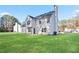 Spacious backyard with a well-manicured lawn and a view of the home's exterior at 12 Windcrest, Covington, GA 30016
