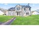 Nice backyard with green grass and the home's exterior at 12 Windcrest, Covington, GA 30016