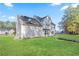 Expansive backyard showing the rear elevation of the house at 12 Windcrest, Covington, GA 30016