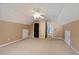 Large bedroom with carpet flooring, vaulted ceilings, and several access doors at 12 Windcrest, Covington, GA 30016