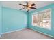 Bright bedroom with carpet floors, ceiling fan, and natural light from the window at 12 Windcrest, Covington, GA 30016