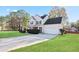 Well-maintained home with a spacious driveway and manicured landscaping at 12 Windcrest, Covington, GA 30016