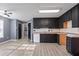 Spacious kitchen with dark cabinetry and ample counter space at 12 Windcrest, Covington, GA 30016