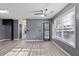 Spacious living room featuring modern gray walls and a large window with natural light at 12 Windcrest, Covington, GA 30016