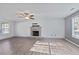 Inviting living room with a decorative stone fireplace and natural light at 12 Windcrest, Covington, GA 30016