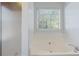 Spa-like soaking tub in the main bathroom with a separate shower at 12 Windcrest, Covington, GA 30016