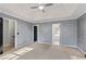 Large main bedroom with a tray ceiling, neutral walls and lots of natural light at 12 Windcrest, Covington, GA 30016