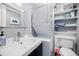 Clean bathroom features modern stacked washer/dryer unit and vanity sink at 198 Ponce De Leon Ne Ave # 5D, Atlanta, GA 30308