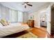 Stylish bedroom features hardwood floors and flows to living area at 198 Ponce De Leon Ne Ave # 5D, Atlanta, GA 30308