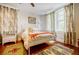 Charming bedroom boasts hardwood floors, bright windows and decorative rugs at 198 Ponce De Leon Ne Ave # 5D, Atlanta, GA 30308