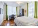 Bright bedroom with hardwood floors, desk, wardrobe, and ample light at 198 Ponce De Leon Ne Ave # 5D, Atlanta, GA 30308