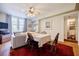 Well-lit living room with hardwood floors, a dining area, and a glimpse into the bathroom at 198 Ponce De Leon Ne Ave # 5D, Atlanta, GA 30308