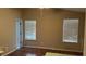 Bright living room with laminate wood flooring and two windows offering natural light at 2820 Skye Ter, Duluth, GA 30096