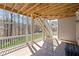 Back porch with brick floor featuring a wooden staircase and view of backyard at 330 Meadowcrest Cir, Canton, GA 30115