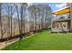 Beautiful backyard featuring a spacious lawn and an elevated deck, perfect for outdoor entertaining at 330 Meadowcrest Cir, Canton, GA 30115