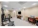 Large finished basement features workout equipment, media area, and neutral carpet at 330 Meadowcrest Cir, Canton, GA 30115