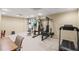 Spacious finished basement featuring workout equipment and neutral carpet at 330 Meadowcrest Cir, Canton, GA 30115