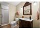 Cozy bathroom featuring a vanity, mirror, a tiled shower with glass door, and neutral colored walls at 330 Meadowcrest Cir, Canton, GA 30115