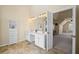 Bright bathroom with double sinks, tile floors, and neutral walls at 330 Meadowcrest Cir, Canton, GA 30115