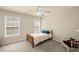 Cozy bedroom with neutral tones, natural light, and a charming rocking chair at 330 Meadowcrest Cir, Canton, GA 30115
