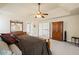 Spacious main bedroom featuring carpeted floors, neutral walls, and a ceiling fan at 330 Meadowcrest Cir, Canton, GA 30115