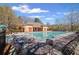 Spacious community pool with numerous chairs and tables, ideal for residents to unwind and socialize at 330 Meadowcrest Cir, Canton, GA 30115
