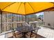 Outdoor deck featuring string lights, an umbrella and table, great for outdoor dining at 330 Meadowcrest Cir, Canton, GA 30115